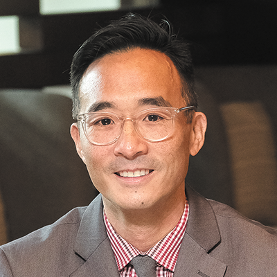 Professional headshot of David H. K. Nguyen
